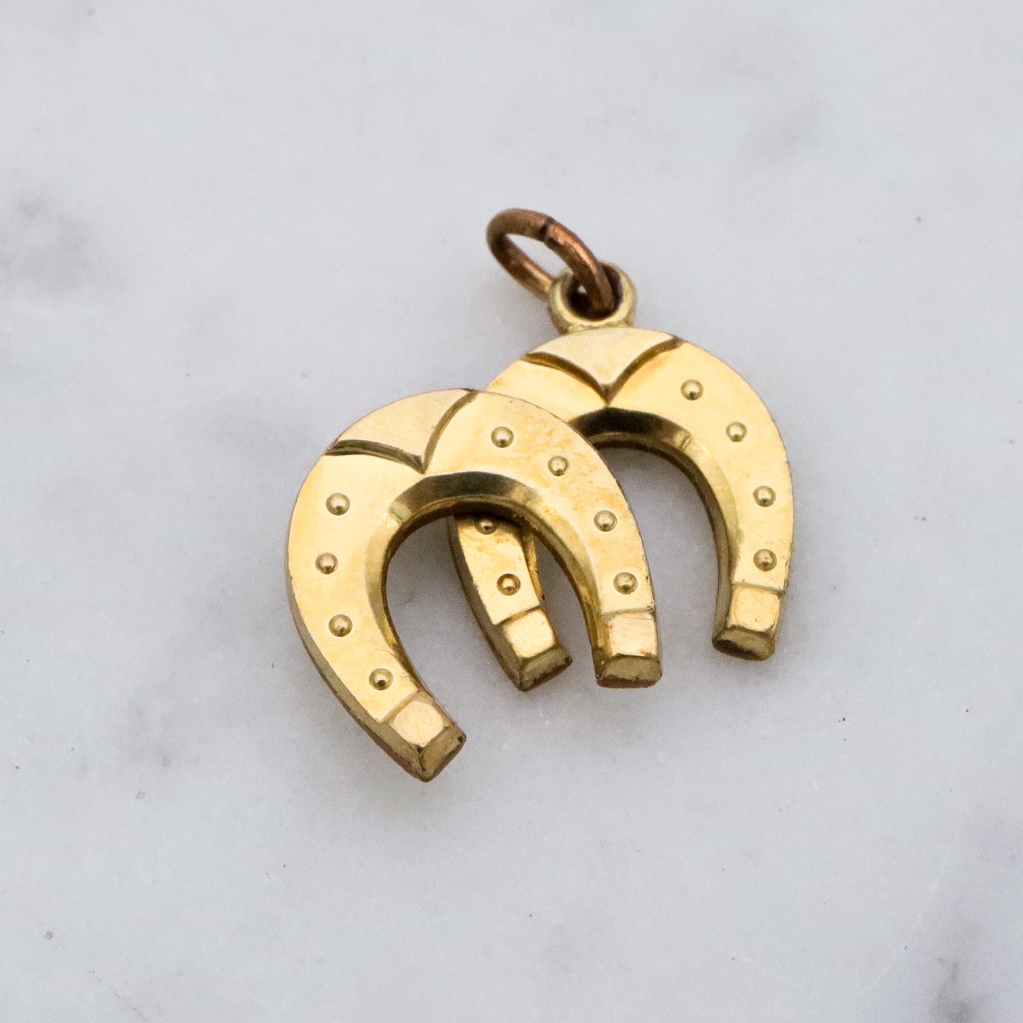 Antique rolled gold double horseshoe lucky charm pendant